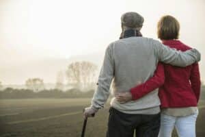 Senior man and daughter in rural landscape