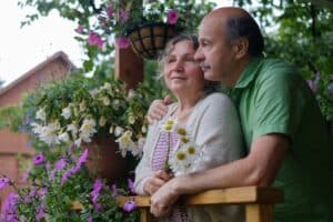 Cheerful senior couple enjoying life at countryside house