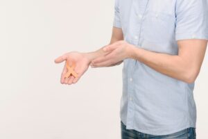 cropped shot of man showing orange leukemia, kidney cancer, multiple sclerosis RSD awareness ribbon