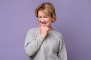 Woman in casual clothes doubting trying to make a right decision or choice