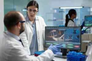 Scientist team discussing coronavirus discovery analyzing biomedical expertise